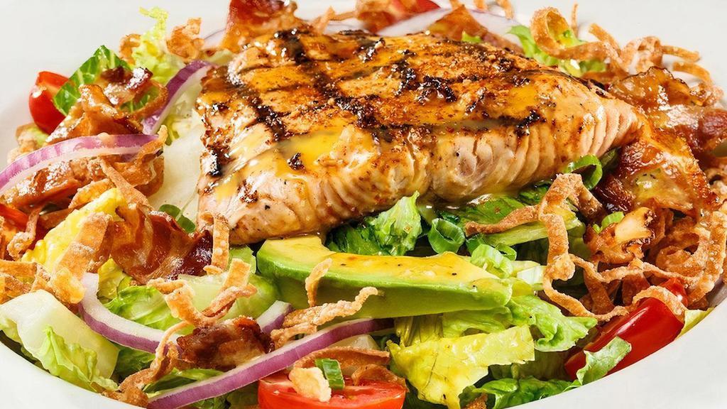 Gf Grilled Salmon Blt Salad · Sweet and smoky salmon, chopped romaine, bacon, tomatoes, red onions, scallions, avocado, crispy tortilla strips, and served with a citrus vinaigrette..