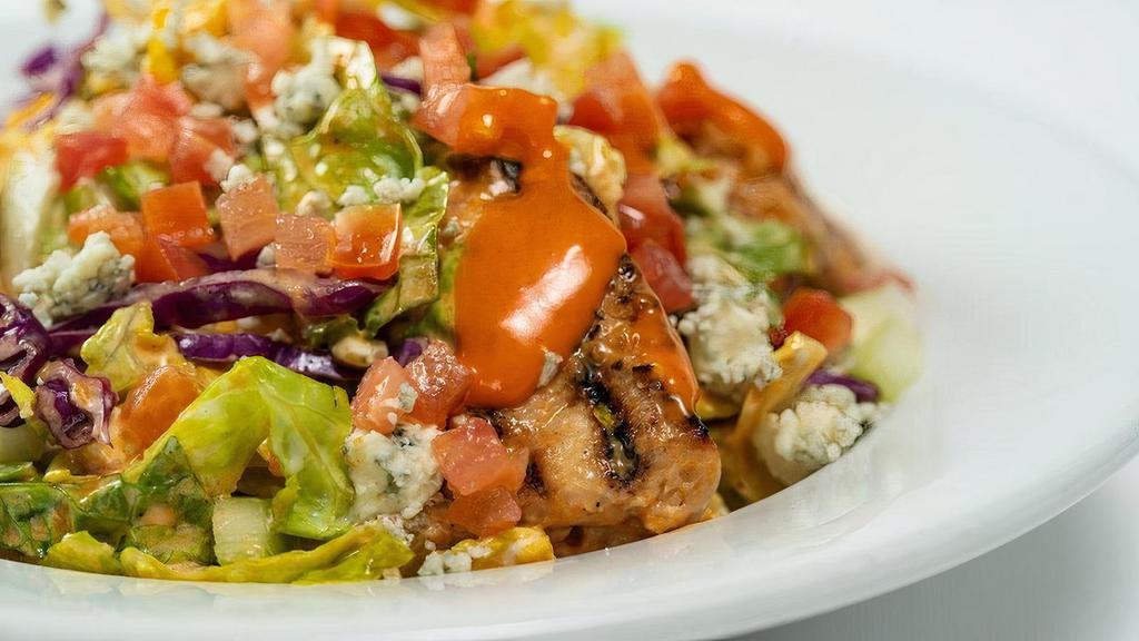 Buffalo Salad (Grilled Chicken) (Full Portion) · Grilled chicken, mild wing sauce, chopped romaine hearts, celery, tomatoes, carrots, cabbage, bleu cheese dressing, and bleu cheese crumbles.