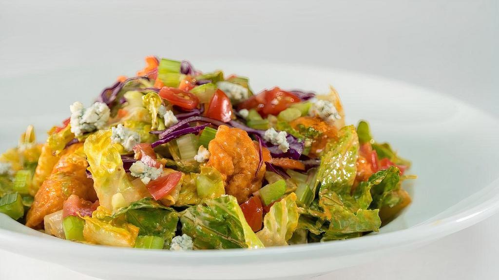 Buffalo Salad (Fried Chicken) (Full Portion) · Crispy boneless chicken, mild wing sauce, chopped romaine hearts, celery, tomatoes, carrots, cabbage, bleu cheese dressing, and bleu cheese crumbles.