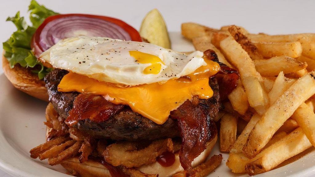 The Glory Burger®† · BBQ sauce, fried onion straws, bacon, cheddar, and a soft fried egg†. .