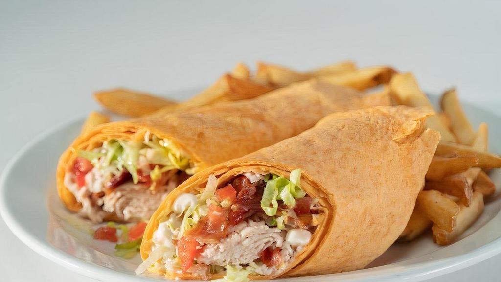 Turkey Blt Wrap · Oven roasted turkey, bacon, lettuce, tomato, and mayo wrapped in a sundried tomato tortilla..