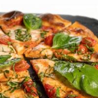 Margherita Pizza · Marinara sauce, mozzarella, tomatoes, Italian herbs, and basil. (serves 2).