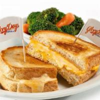 Grilled Cheese · Melted American cheese between hearty white bread with a side.  Calories calculated based  o...