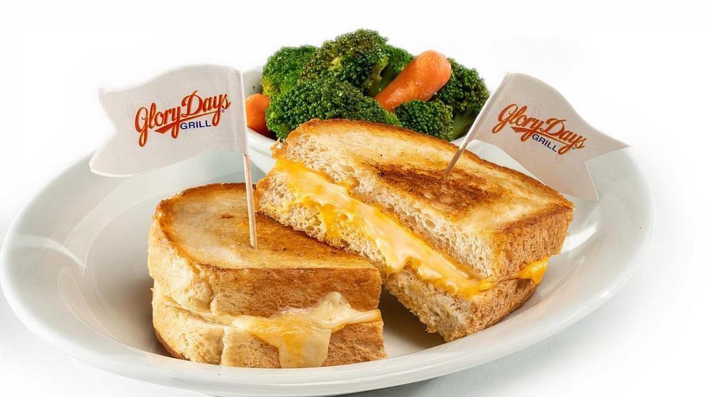 Grilled Cheese · Melted American cheese between hearty white bread with a side.  Calories calculated based  on a side of seasonal vegetables.