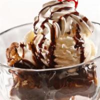 Cleveland Brownie Sundae · Fudge-walnut brownie, vanilla ice cream, hot fudge, and whipped cream. .