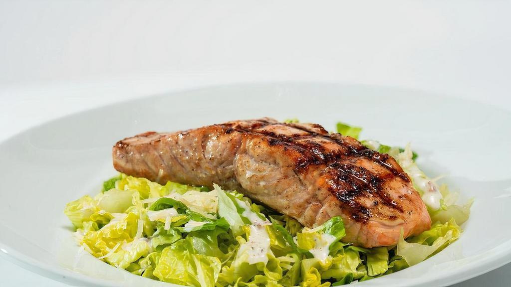 Salmon Caesar Salad · Chopped romaine, Caesar dressing, croutons, Parmesan, and grilled salmon..