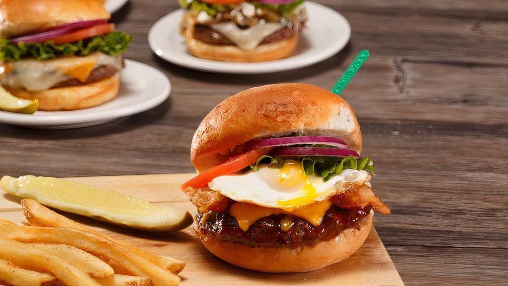 Gf Glory Burger®† · BBQ sauce, bacon, cheddar, and a soft fried egg†. . (No fried onion straws).