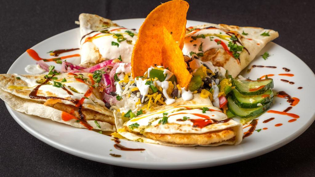 Jose'S Quesadillas Plato Principal · Grilled flour tortillas filled with vegetables, cheese, protein, and tomatillo sour cream sauce. Served with black beans and rice.