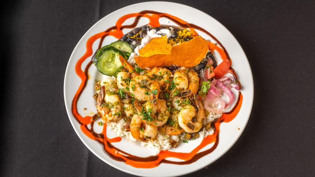 Camarones Bohemios · Shrimp sautéed in a lime and tequila sauce with sweet peppers, onions, and parsley. Served over rice with black beans, sour cream, and cheese.