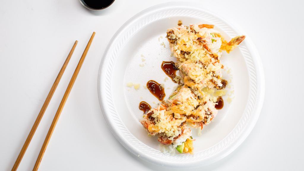 Sr08. Yum Yum Roll · Top menu item. Shrimp tempura, cucumber, avocado, topped with toasted spicy shrimp and crab.