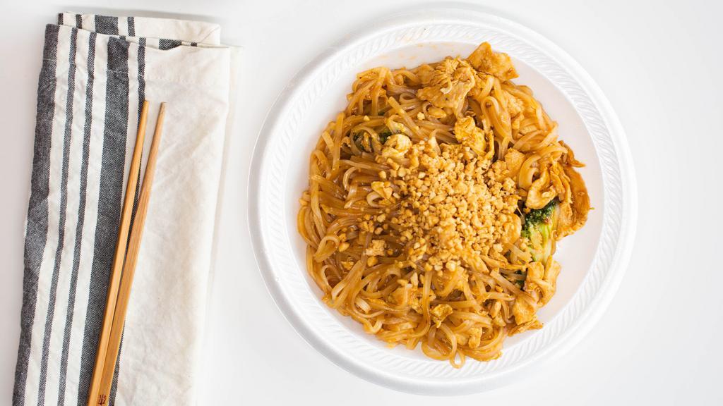 Chicken Pad Thai · Hot and spicy. Rice noodles stir-fried with crushed toast peanuts and scallion egg. Served with white rice.