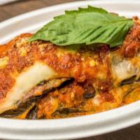 Eggplant Parmigiana · Eggplant, tomato sauce, fresh basil, topped with fontina and browned Parmesan cheeses.