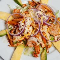 Rancho Salad · Grilled chicken and shrimp cooked with bell peppers, served on a bed of romaine lettuce, and...