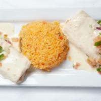 Cheese Burritos · Two steak and bean burritos smothered in cheese dip, topped with pico de gallo and served wi...