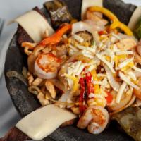 El Molcajete · A combination of grilled beef, chicken, shrimp, and chorizo prepared with onions, nopales (c...