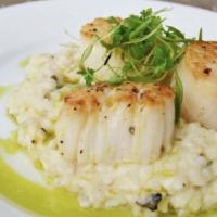 Seared Scallops · Risotto, lemon, Parmesan, black truffle, rosemary, and chive oil.