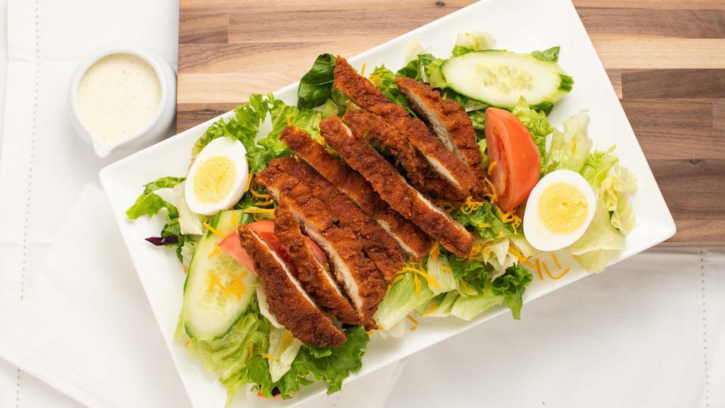Grilled Or Fried Chicken Salad · A bed of mixed greens topped with your choice of grilled or fried chicken, cheese, tomato, cucumber and egg, served with your choice of dressing