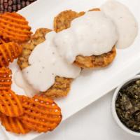Country Fried Steak · Breaded cubed steak, fried golden brown and smothered with white country gravy