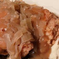 Buttermilk Pork Chops · Center cut buttermilk marinated pork chop served with caramelized onions, mashed potatoes, s...
