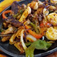 Steak & Shrimp · Sizzling hot with onions, bell peppers and tomatoes. Served with guacamole salad, pico de ga...