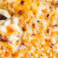 Baked Mac & Cheese · Well seasoned oven baked blend of cheeses mixed over elbow macaroni and buttermilk to give t...