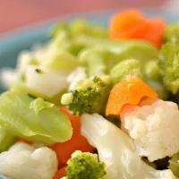 Steamed Veggies · Normandy Blend with broccoli florets, cauliflower florets, baby carrots, and yellow squash.