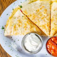 Quesadilla · Choose from Cheese, chicken, or Beef. Seasoned and pan-seared golden brown then chopped, coo...