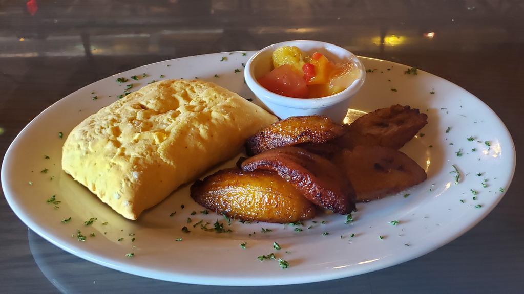 Taste Of The Tropics · Well-seasoned beef in a flaky shell and served with plantains and Caribbean mango and pineapple salsa