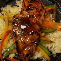 The Drunken Chicken · Chicken breast marinated and grilled in bourbon sauce and served over roasted peppers and rice