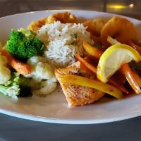 Surfin’ Seared Salmon · Salmon filet grilled and sautéed with veggies and served on bed of steamed Basmati  rice and...