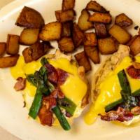 Barb'S Benedict · Chicken and asparagus topped with poached eggs, hollandaise sauce & crumbled bacon over engl...