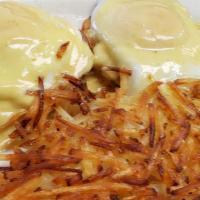 Traditional Benedict · Topped with poached eggs and hollandaise over english muffin.