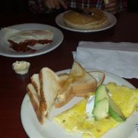 Caribbean Omelete · Bacon & pepper jack topped with avocado and sour cream.