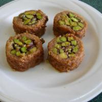 Borma · Crunchy shredded phyllo wrapped around chopped pistachios or cashews. Sold by the pound.