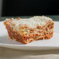 Lasagna · Layers of baked lasagna loaded with beef, parmesan, mozzarella and ricotta cheeses topped wi...