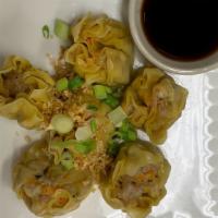 Thai Dumplings(6) · Stuffed of chicken wrapped in a wonton skin steamed topped with fried garlic, scallions serv...