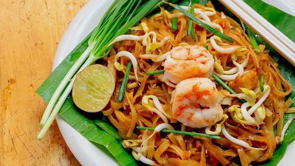 Pad Thai · Thai favorite dishes rice noodles sautéed with eggs, ground peanuts, bean sprouts & green onions.