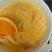 Pineapple Yellow Curry* · Yellow curry paste simmered in coconut milk with carrot, onion, pineapple and Thai herbs  se...