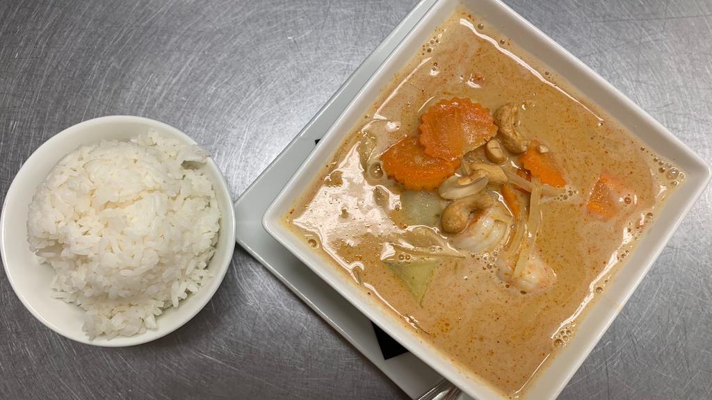 Massamun Curry* · Massaman curry sauce with potatoes onion and carrot garnished with cashew nuts  served with rice.