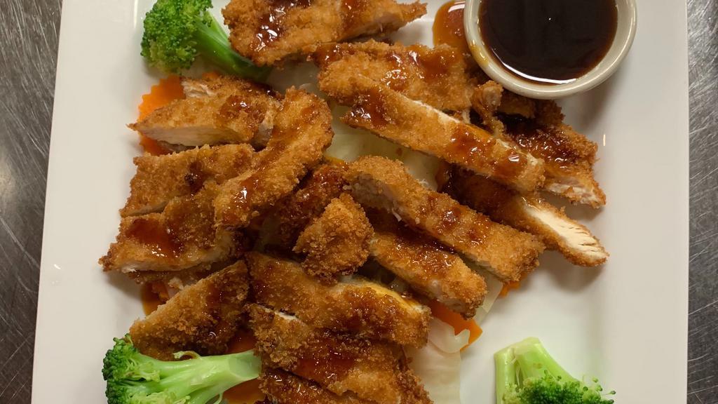 Crispy Chicken Teriyaki · Chicken strips dipped in a light batter and lightly fried served over fresh mix veggies with teriyaki sauce with jasmine rice.