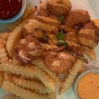 Dynamite Shrimp · Shrimp dipped in a light batter and fried mixed with sweet mayo sauce served with French Fri...