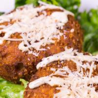 Parmesan Potato Cakes · Fresh potatoes with herbs and parmesan cheese breaded and deep fried. Topped with dill musta...