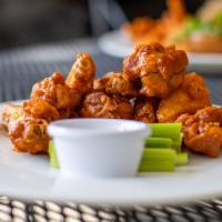 Buffalo Wings · Eight wings served with house made bleu cheese and celery.