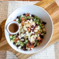 Large Chopped Salad · Chopped greens topped with feta, toasted almonds, craisins, diced tomato, and cucumbers.