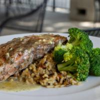 Salmon · Grilled salmon filet topped with a lemon dill butter sauce. Served with wild rice and brocco...