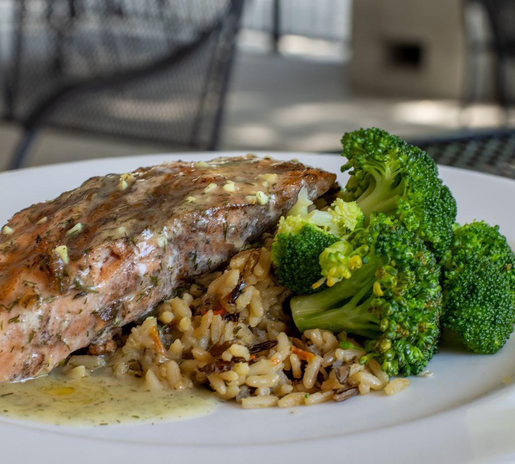 Lemon Dill Salmon · Grilled salmon filet topped with a lemon dill butter sauce. Served with wild rice and broccoli.