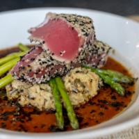 Sesame Tuna · Sesame seared Ahi tuna steak over wild rice risotto and asparagus. Finished with a ginger te...