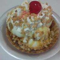 Sweet Jo Sundae · We start with a waffle bowl, fill it with Butter Pecan ice cream, add butterscotch topping, ...