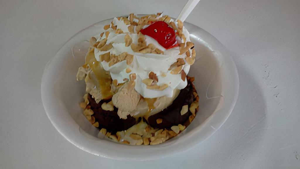 Life Of The Party Sundae · We start with two warm brownies, add Coffee ice cream, caramel topping, whipped cream, nuts and a cherry!
