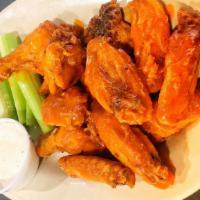 Wings · Served with blue cheese or ranch dressing and celery. extra dipping sauce for an additional ...
